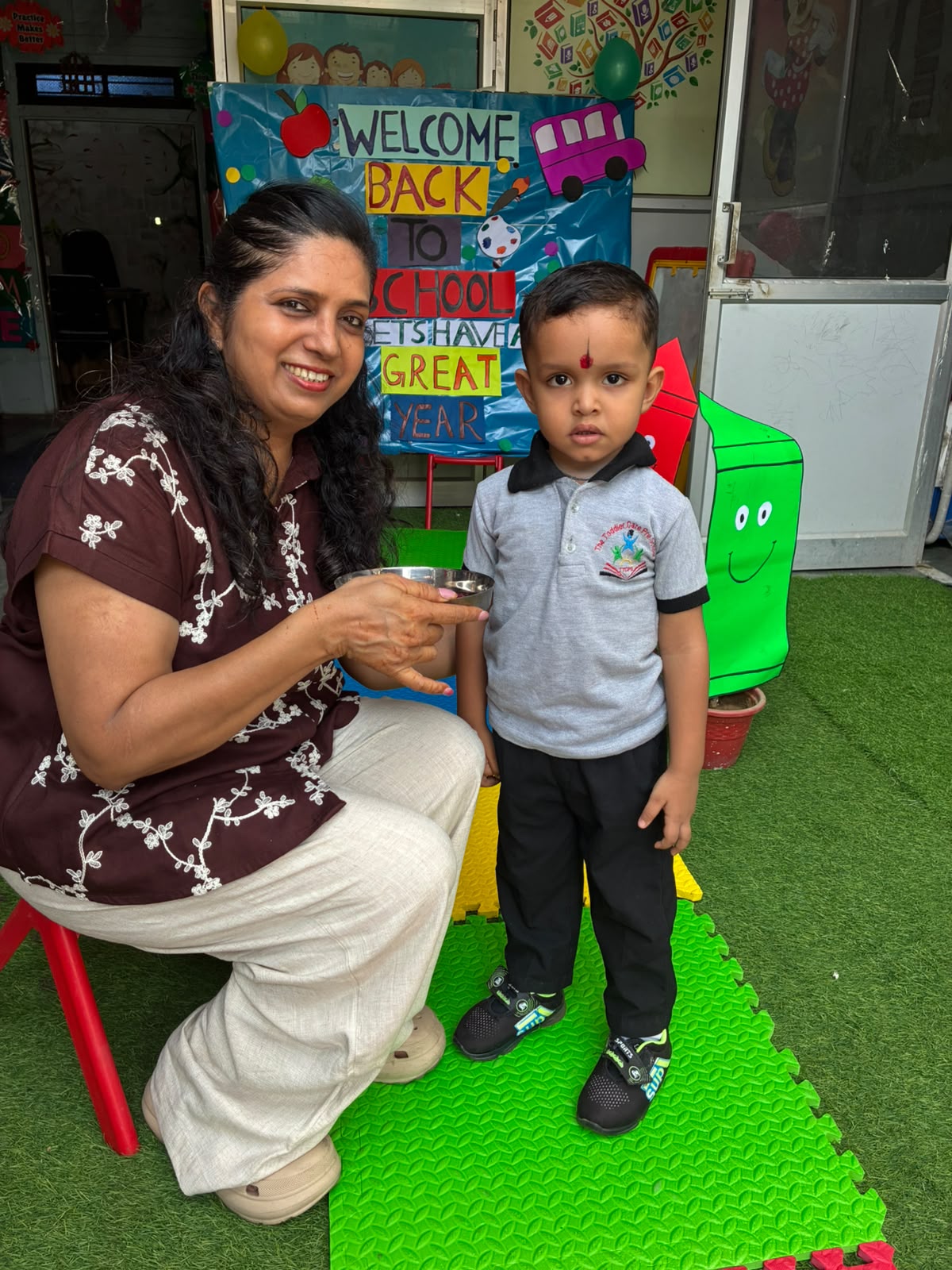 Nursery children with teachers at The Toddler Care