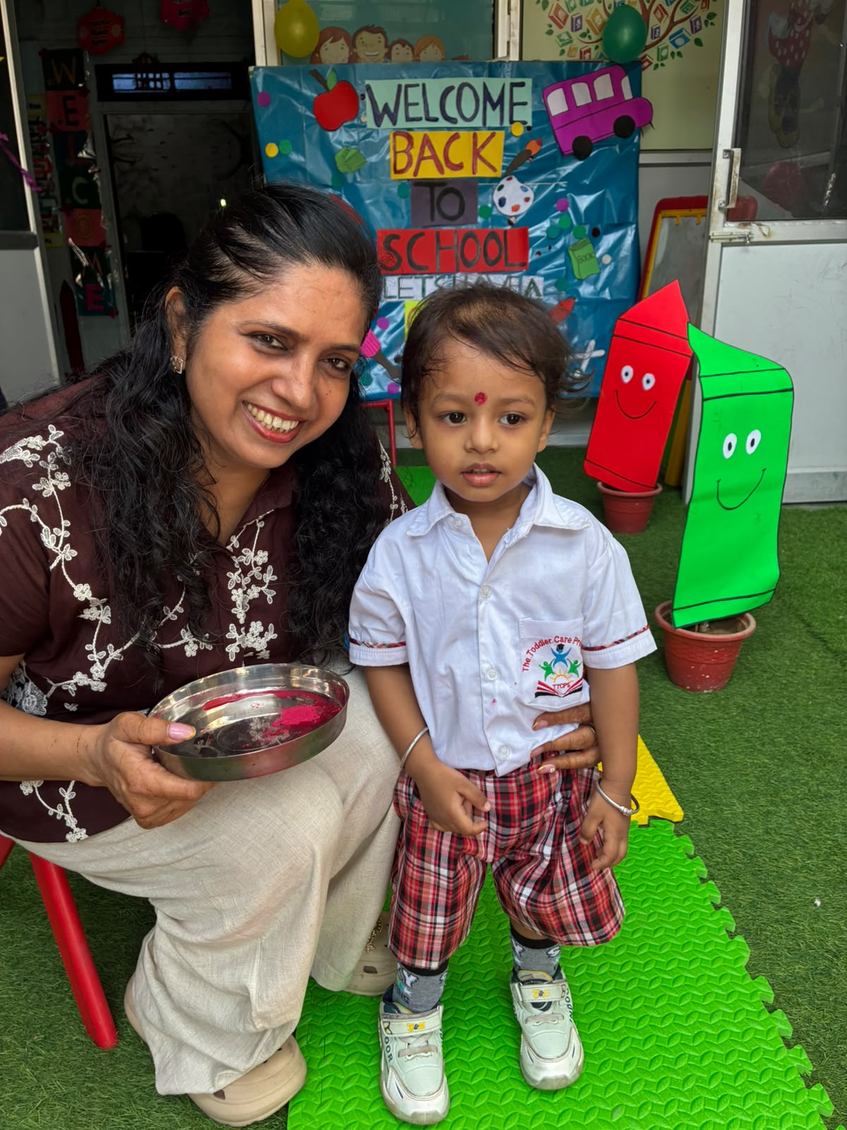A teacher reading a picture book to toddlers